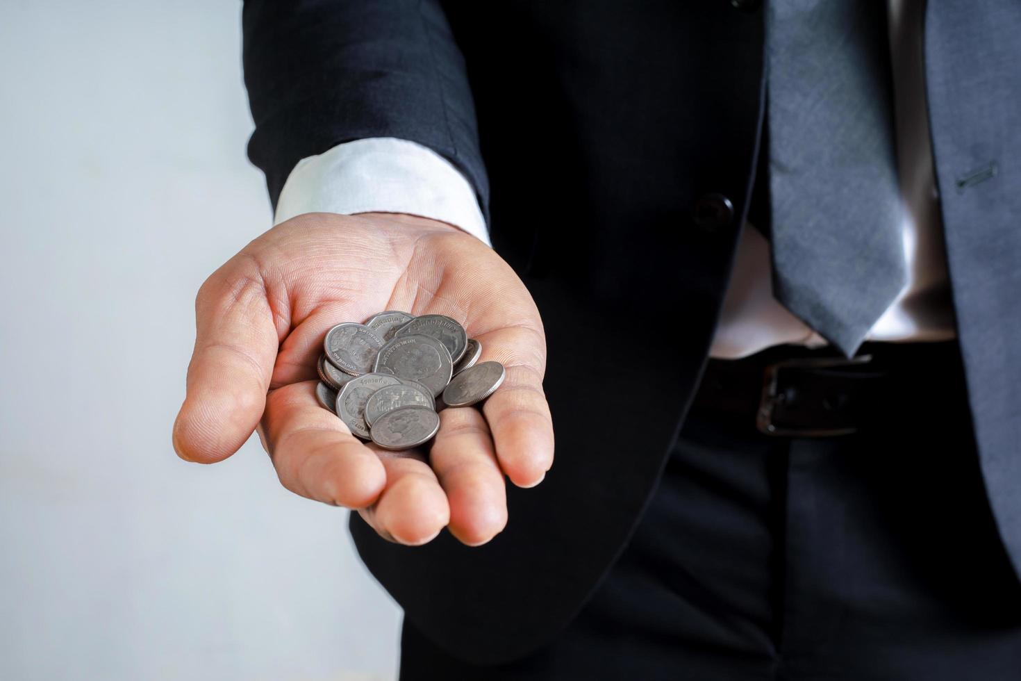 Businessmen hold coins as the heart of business growth. Money Saving Ideas to Increase Investment Profit Accounts photo