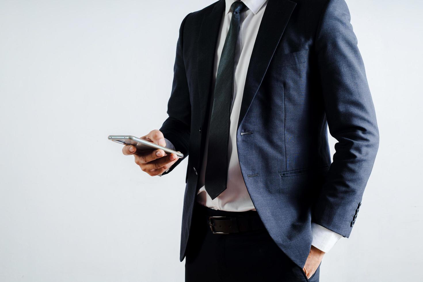 businessman using mobile phone on a white background photo