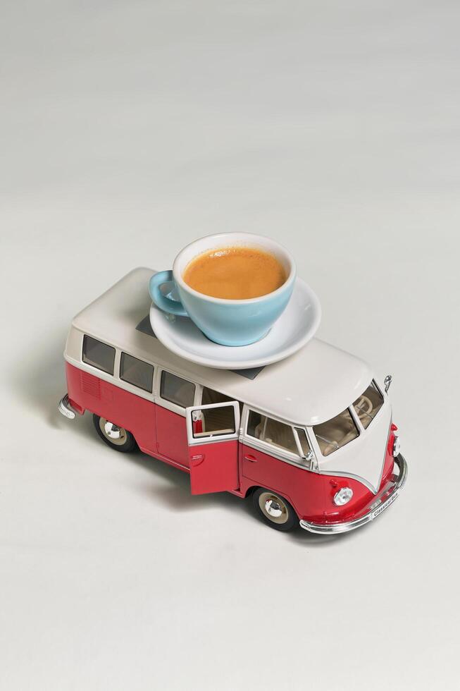 Conceptual Espresso Cup with Shadow on Wooden Table photo