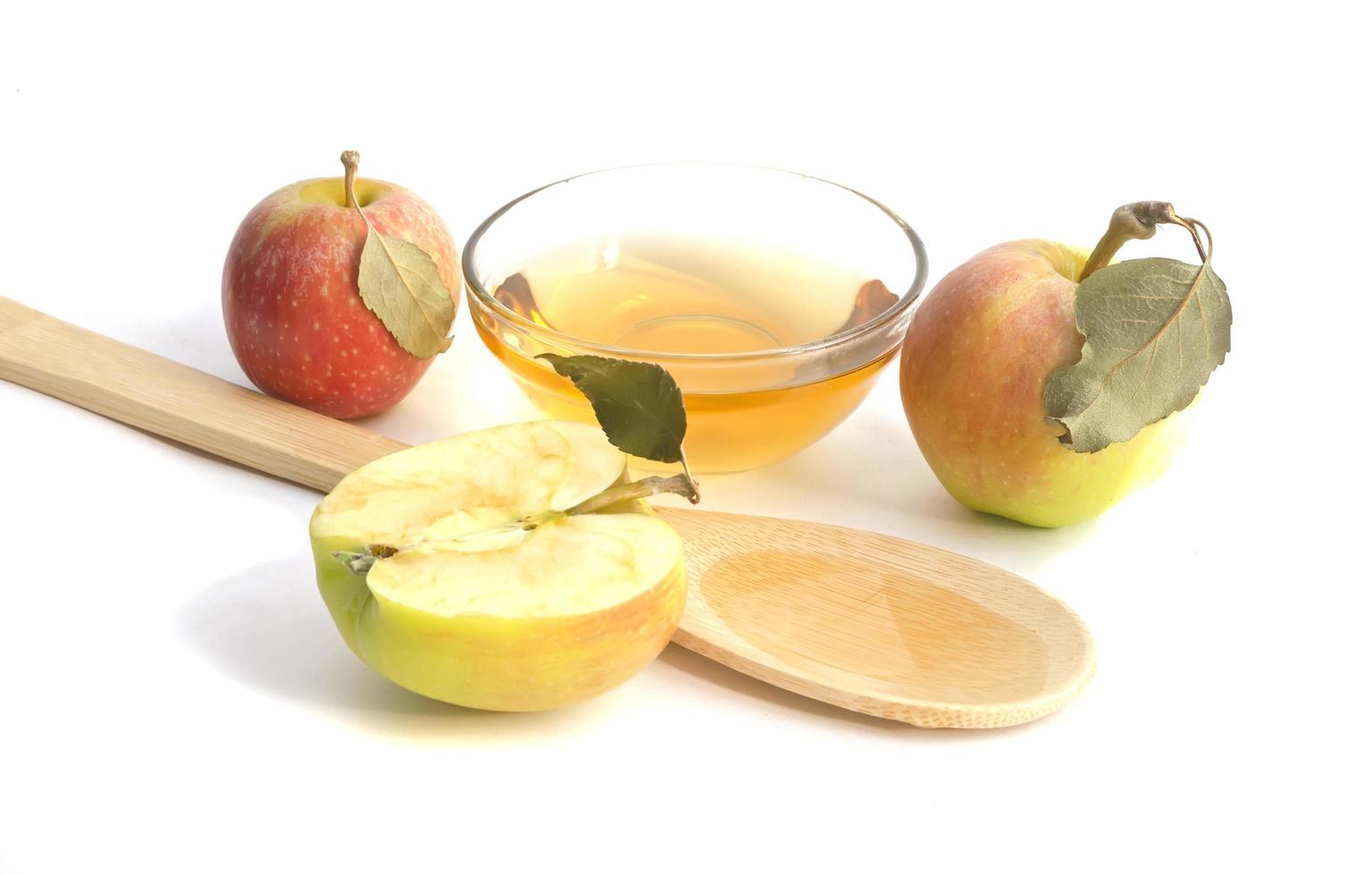 Vegetarian fruit composition.Several objects of apple cider vinegar isolated on white background. photo