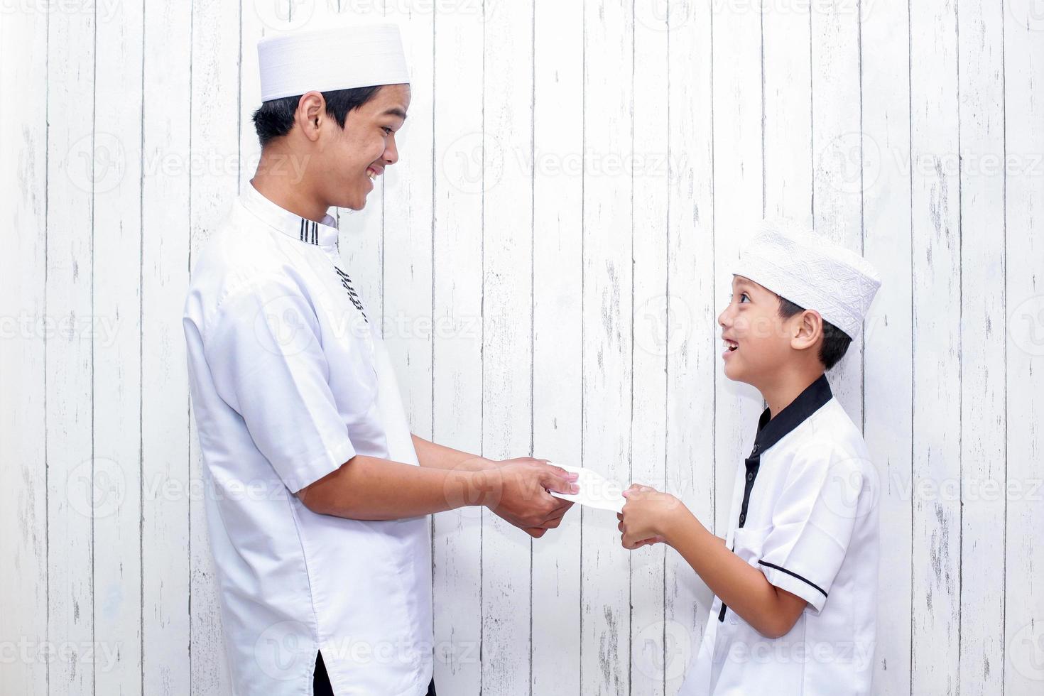 Indonesian people tradition during Eid Mubarak celebration of distributing money or called THR photo