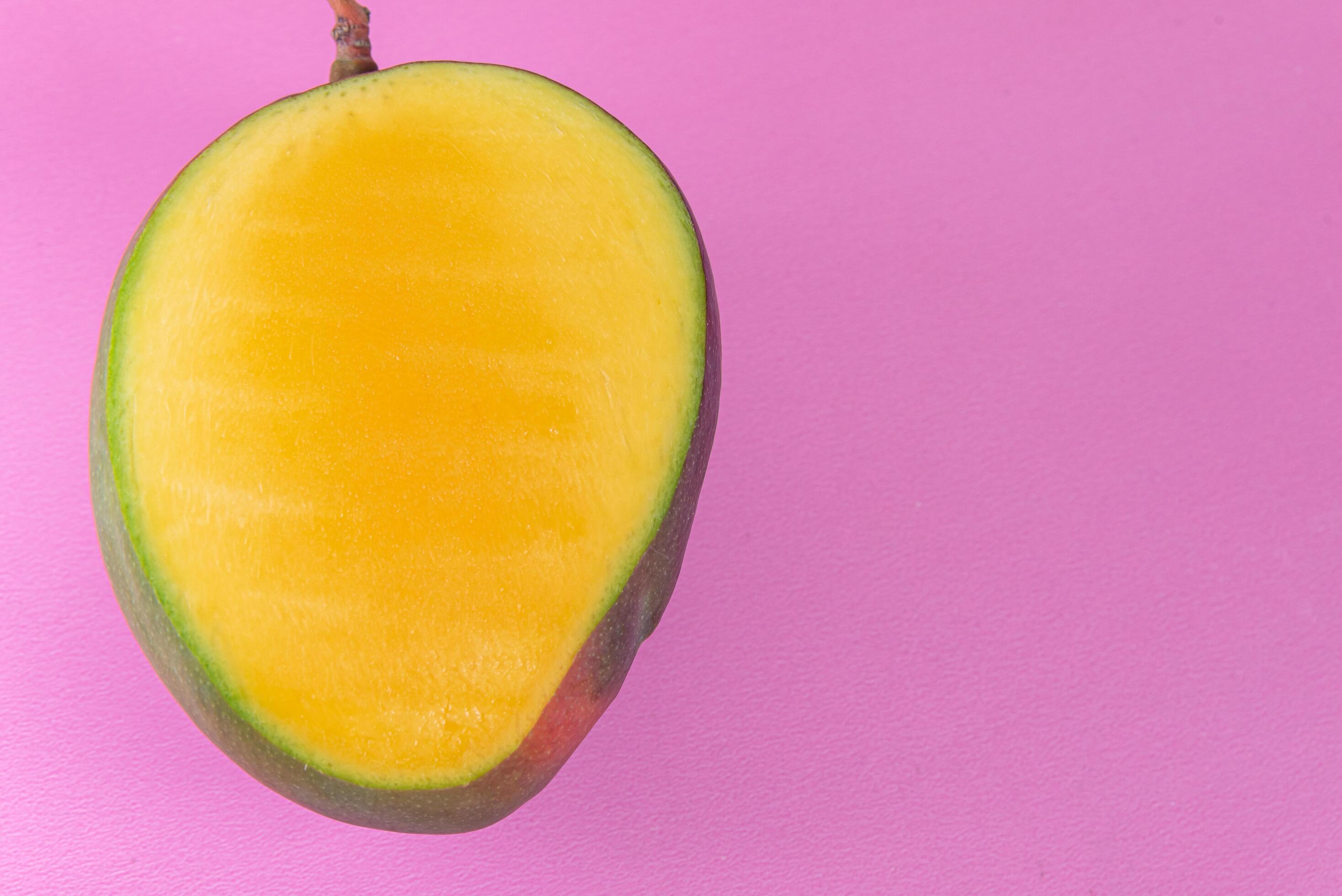 Mango on the pink background 6419958 Stock Photo at Vecteezy