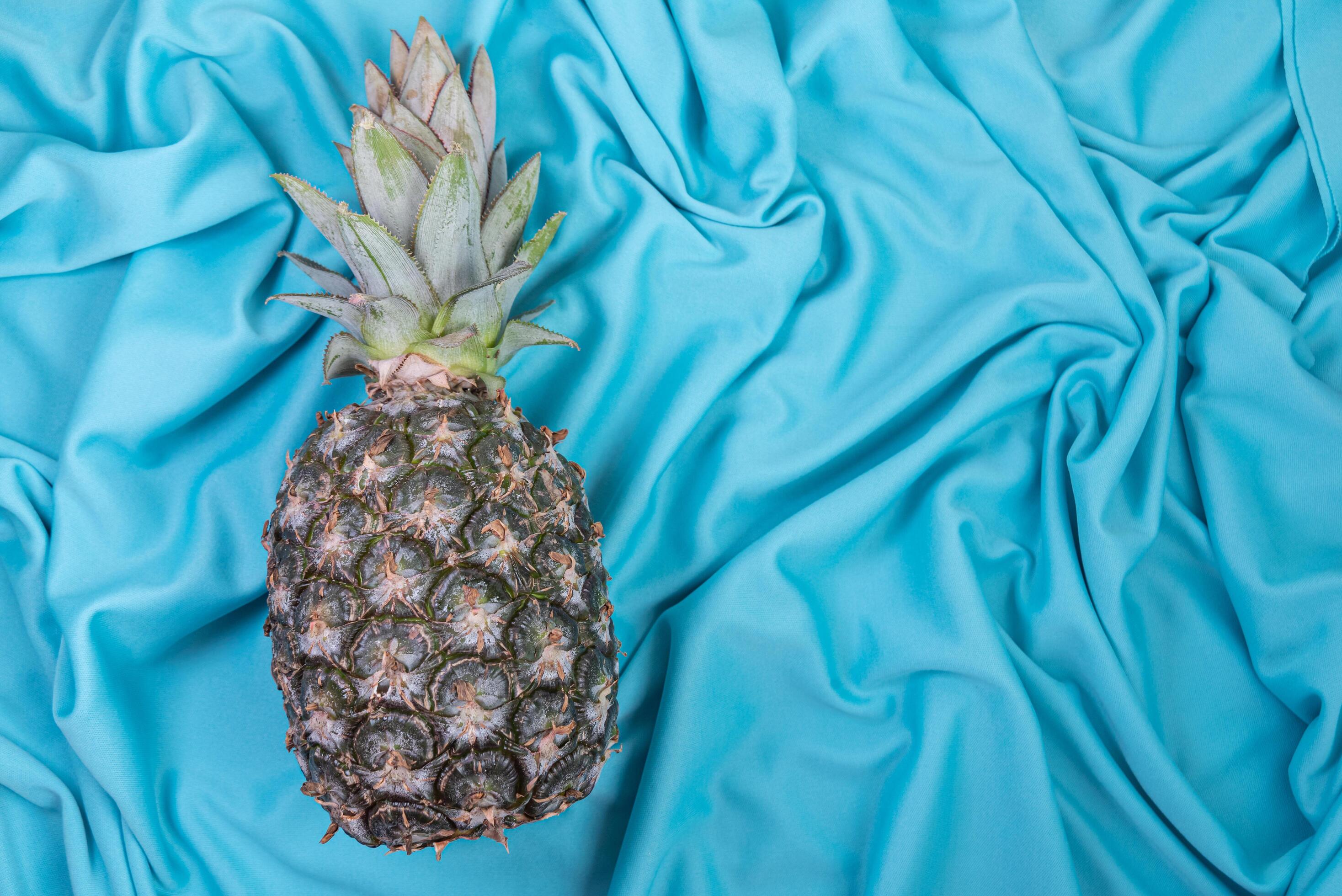 Pineapple on the blue background 6419968 Stock Photo at Vecteezy