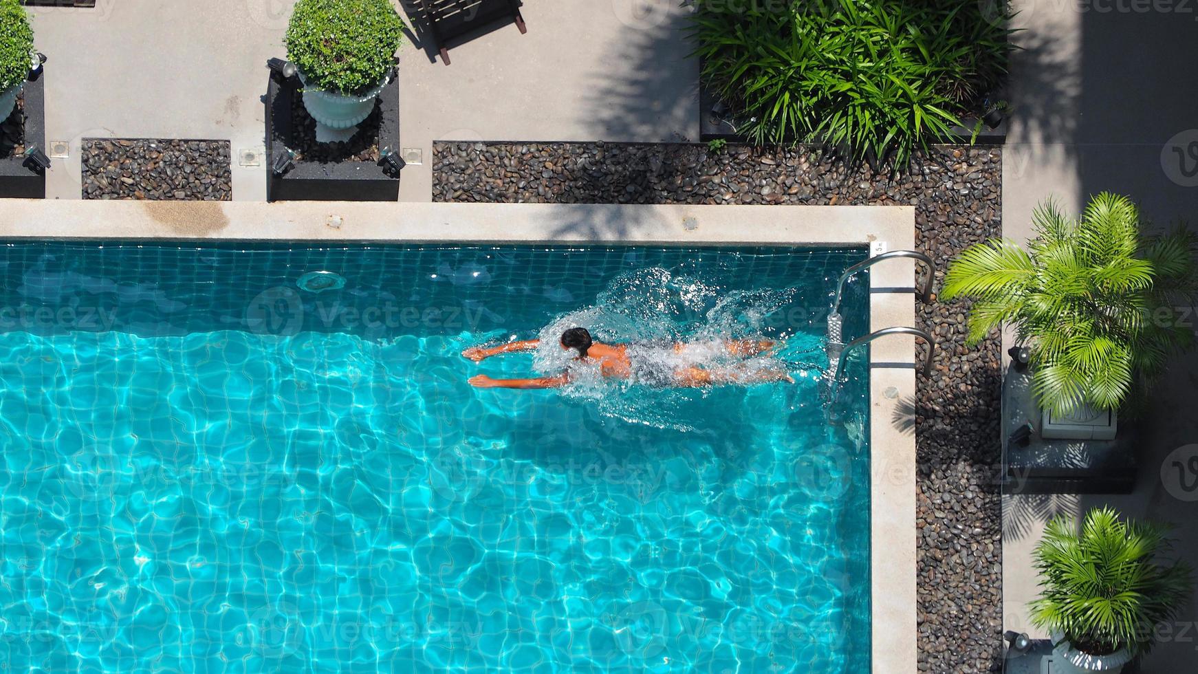 Aerial view images of swimming pool in a sunny day. photo