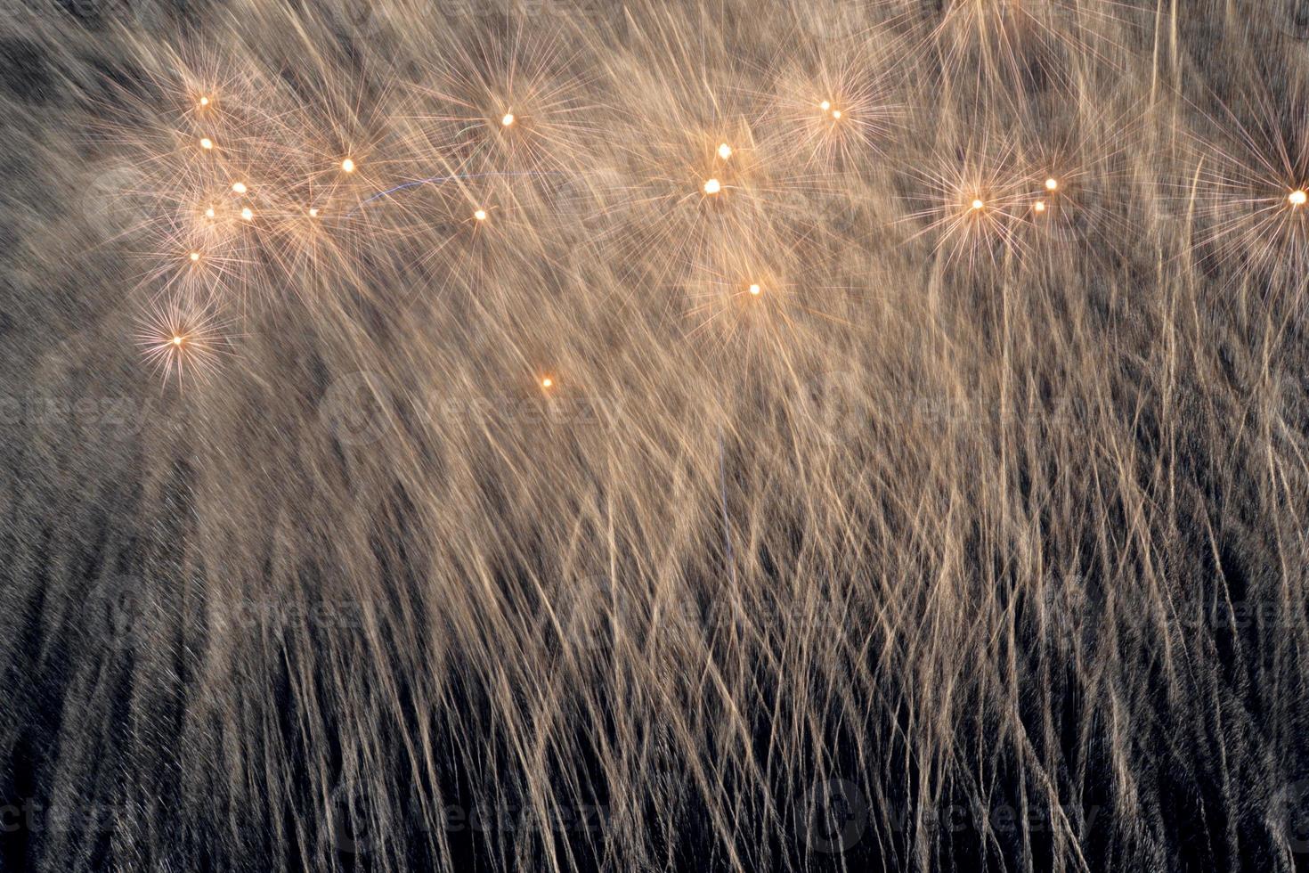 Explosive fireworks with a shower of sparks. Fireworks during a Festival in Sicily in the Mediterranean.Beautiful bright fireworks that light up the night. photo