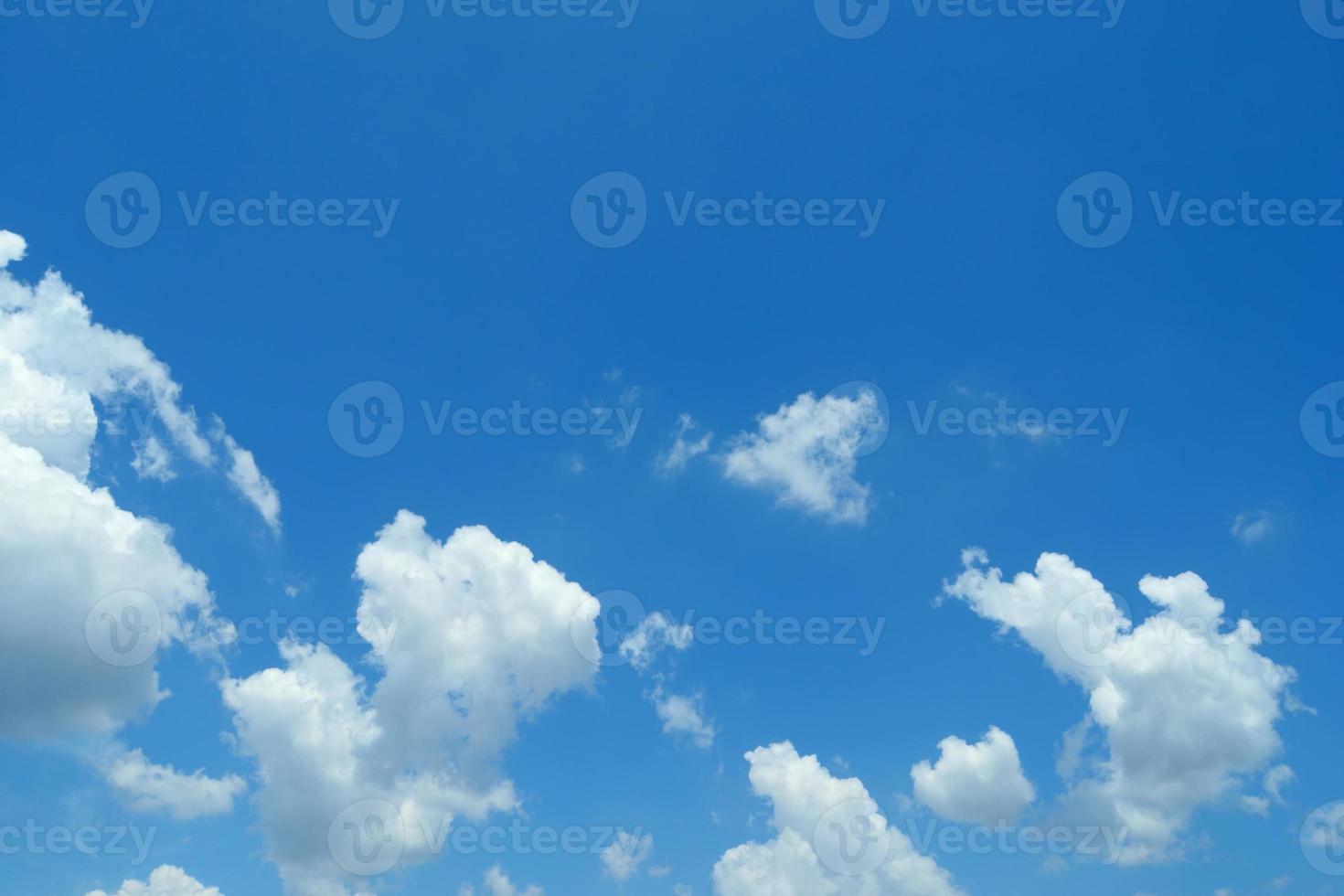 Clouds in the blue sky. clear sky. White clouds in the beautiful blue sky.Blue sky with white clouds in the background.White fluffy clouds in the blue sky. photo