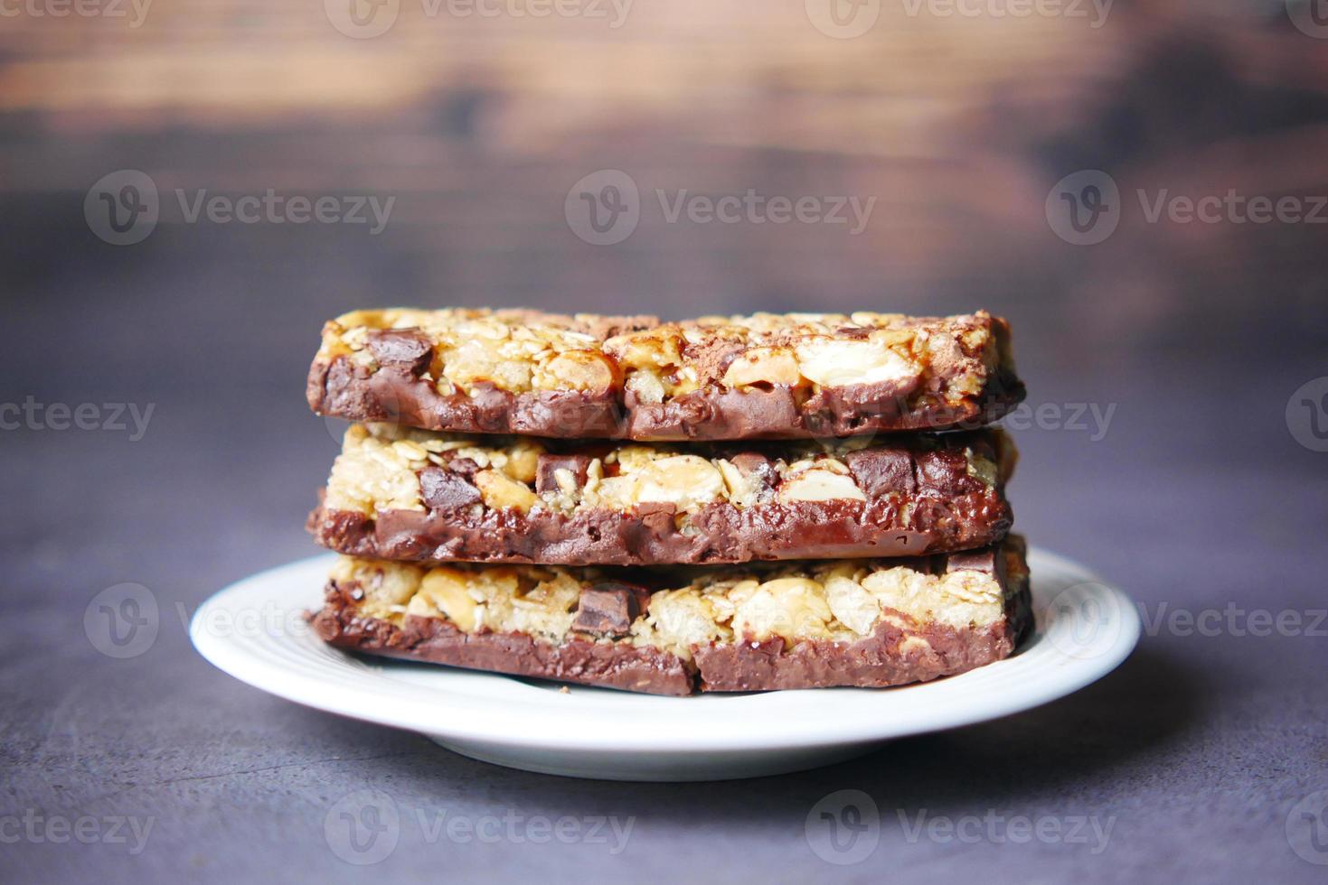 Almond , Raisin and oat protein bars on table photo