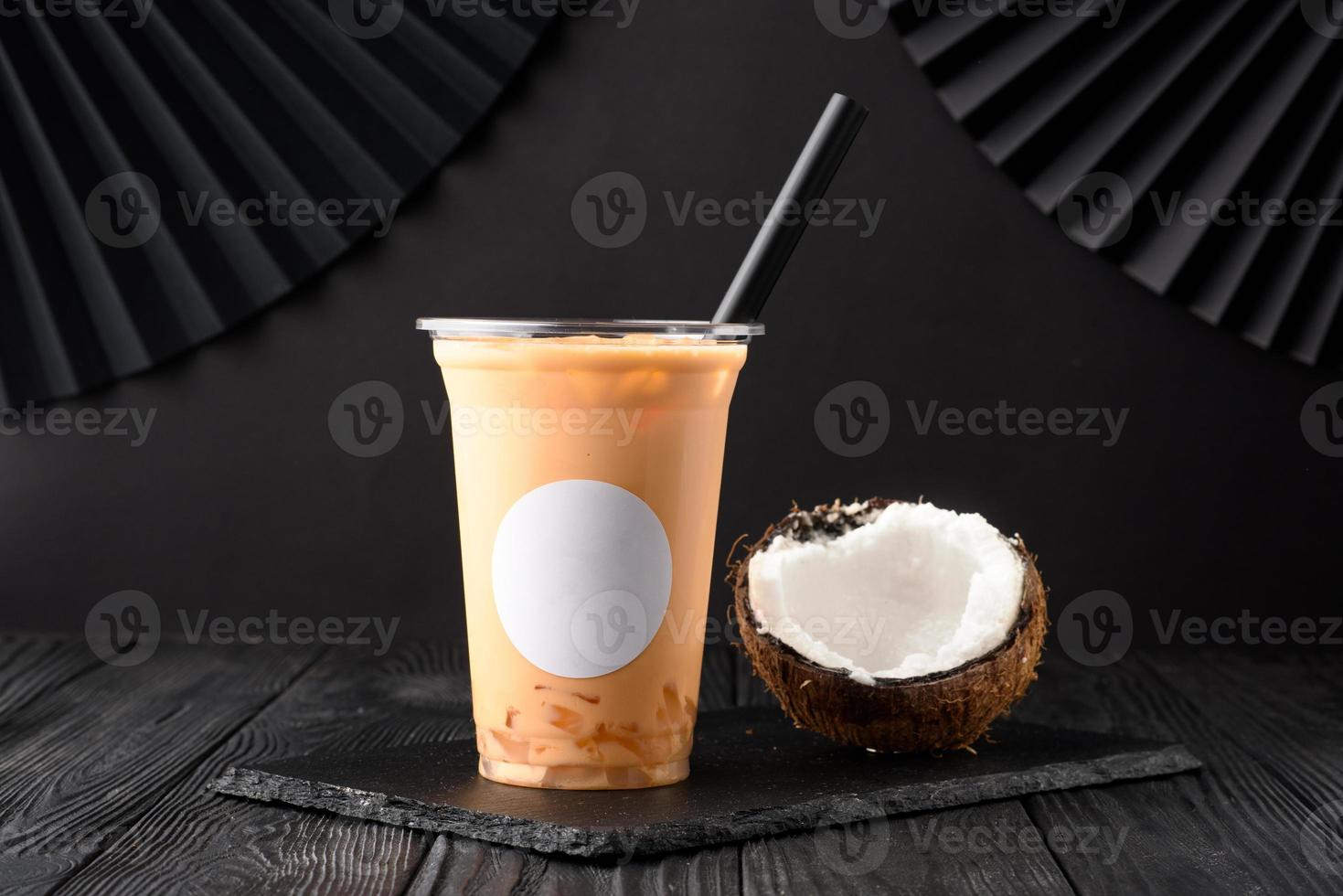 Taiwan milk tea with coconut and mango on wooden background photo