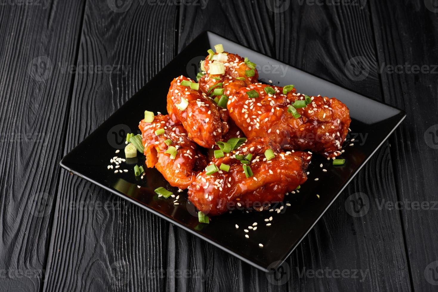 Chicken wings. Traditional asian recipe. Dark background. Copy space. Top view. photo