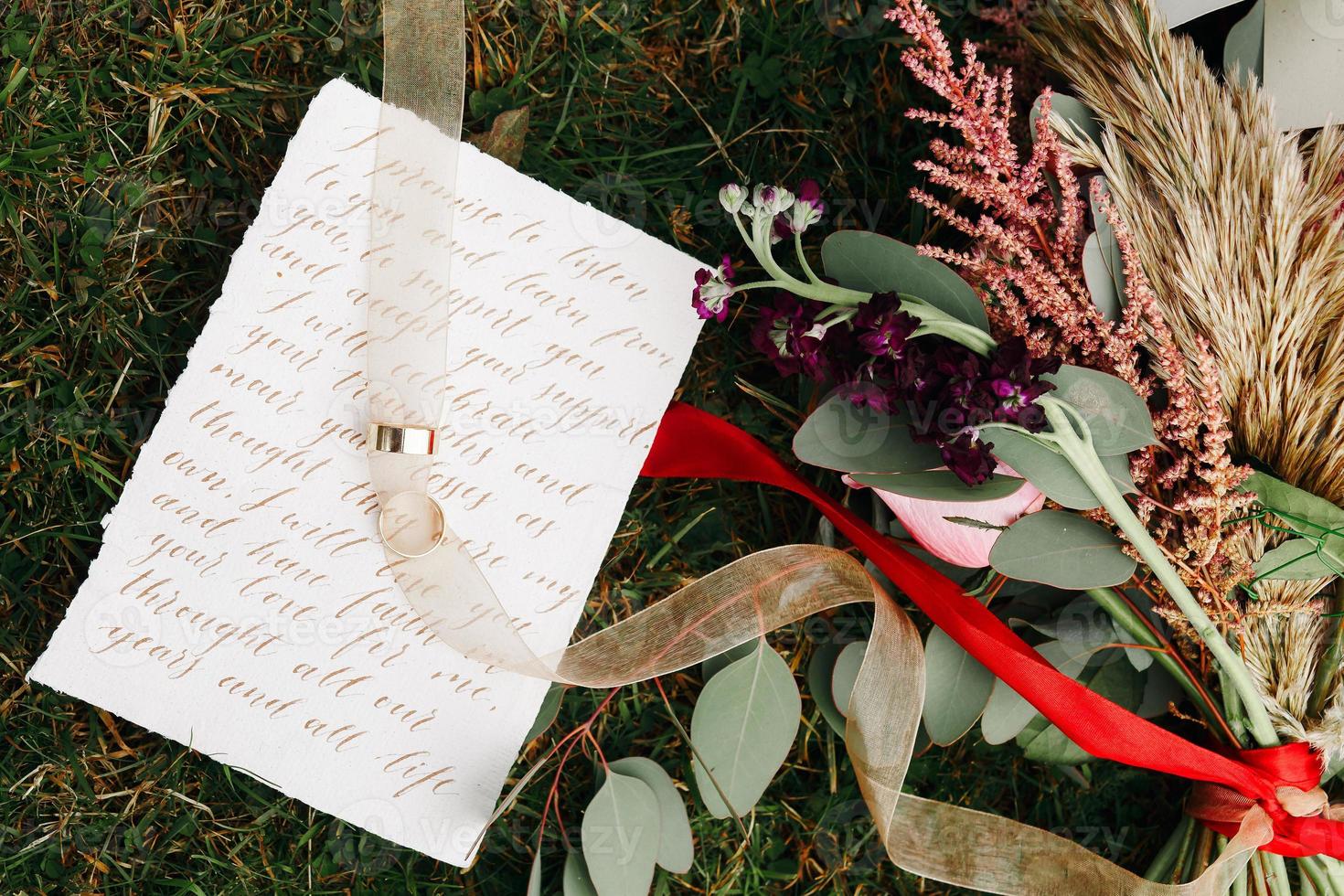 Wedding details flat lay. Wedding invitation. Ring box. Wedding bouquet. Mock up. Envelope. Copy space. photo