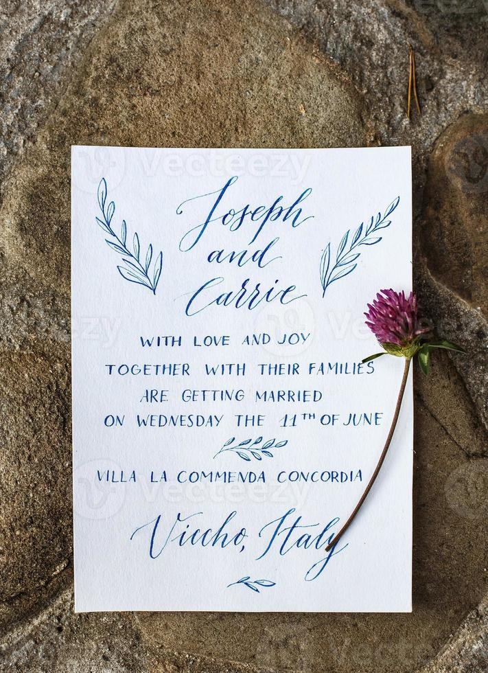 Wedding details flat lay on stone background. Wedding invitation. Ring box. Mock up. Copyspace. photo