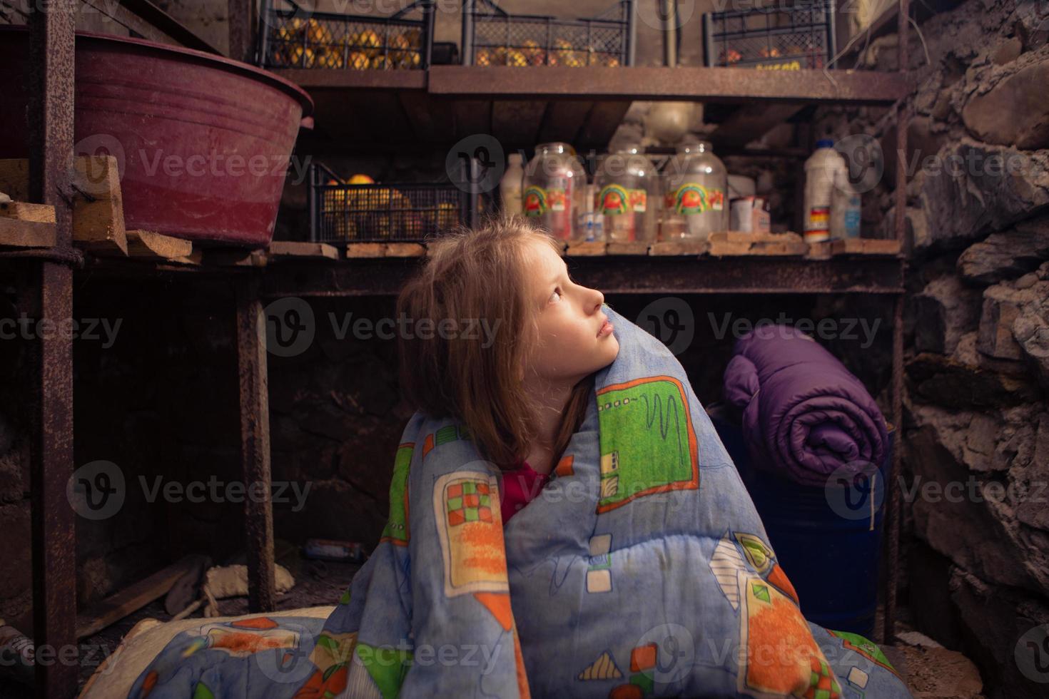 Ukrainian girl takes shelter in her basement. Stop war photo