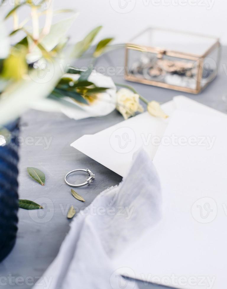 Blank paper copy space. Frame with flowers. Silk ribbon. Gray background. Simple bouquet. Greeting card. photo