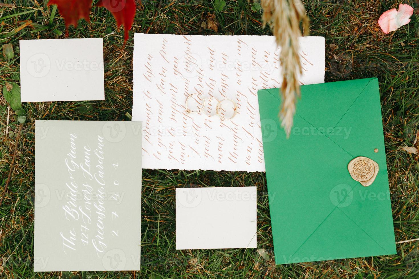 Wedding details flat lay. Wedding invitation. Ring box. Wedding bouquet. Mock up. Envelope. Copy space. photo