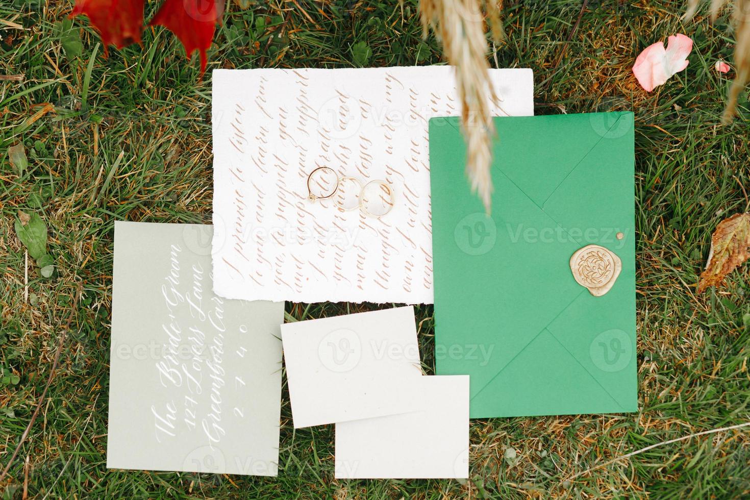 Wedding details flat lay. Wedding invitation. Ring box. Wedding bouquet. Mock up. Envelope. Copy space. photo