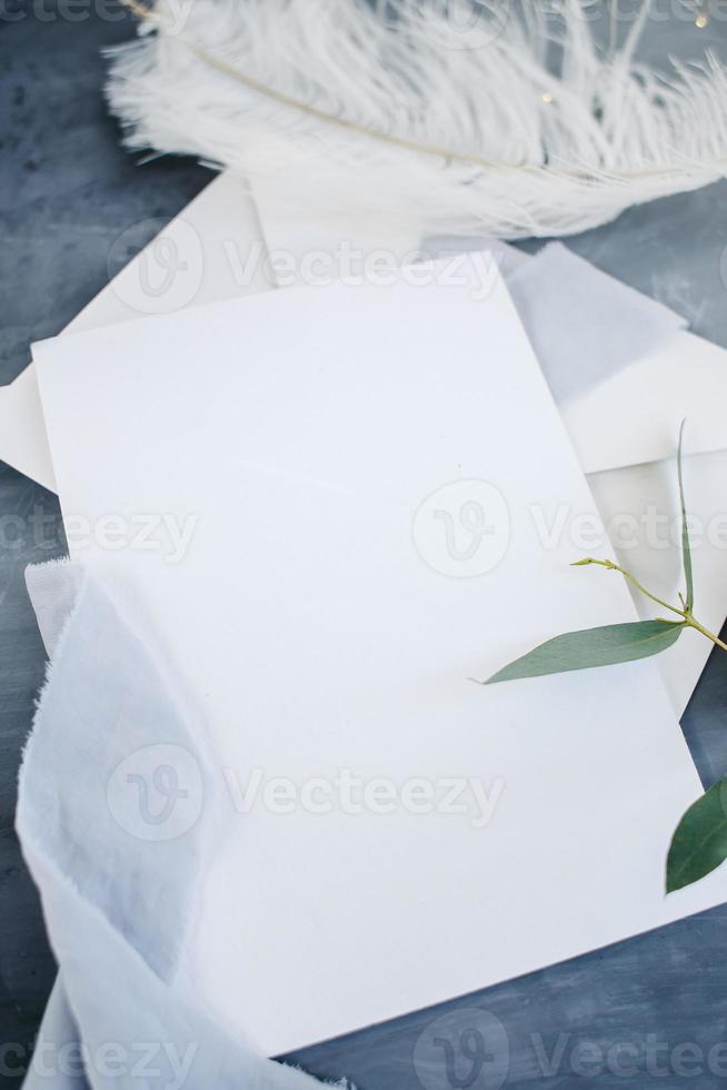 Blank paper copy space. Frame with flowers. Silk ribbon. Gray background. Simple bouquet. Greeting card. photo