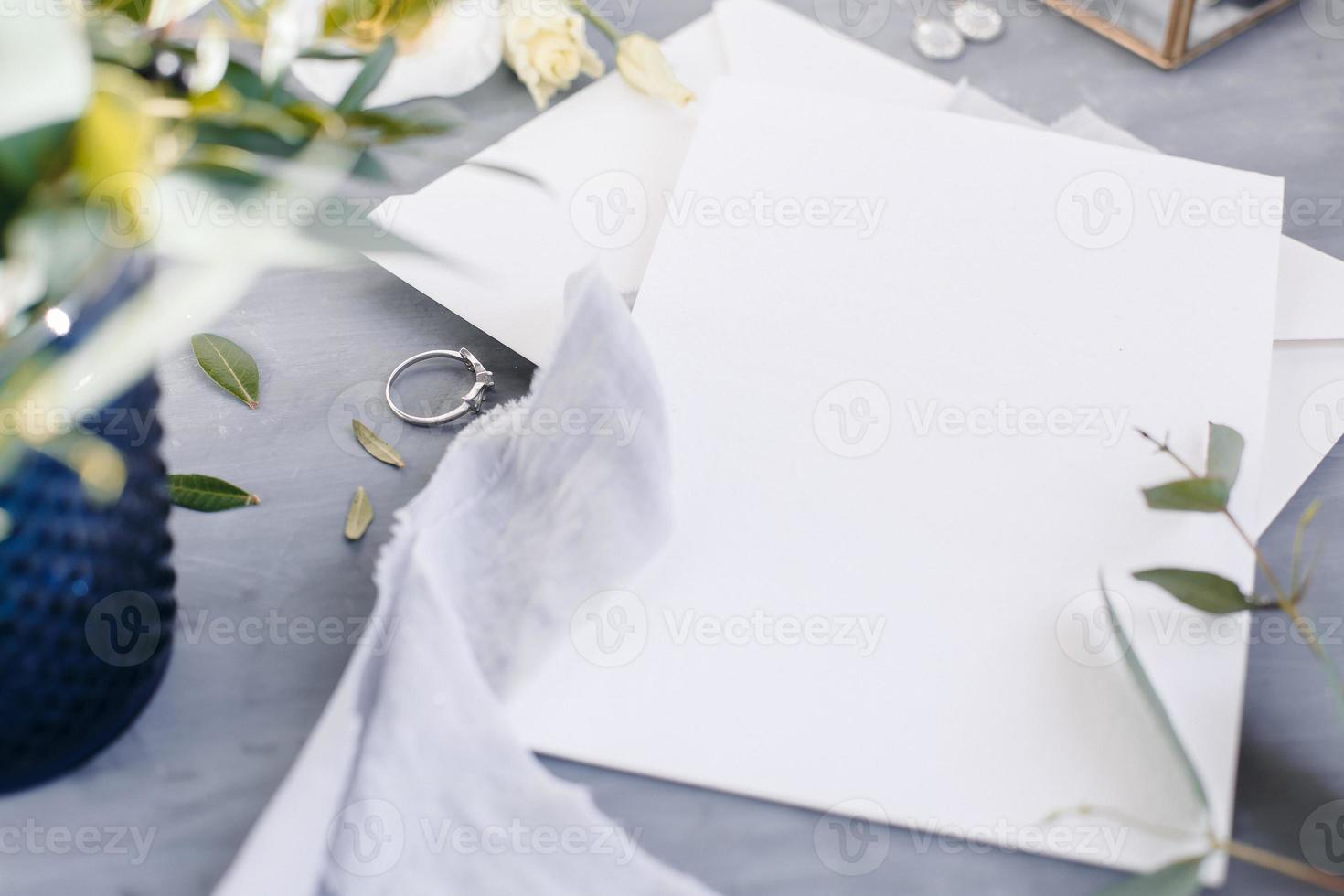Blank paper copy space. Frame with flowers. Silk ribbon. Gray background. Simple bouquet. Greeting card. photo