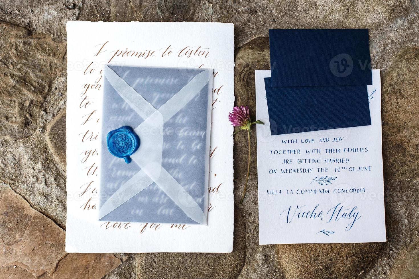 Wedding details flat lay on stone background. Wedding invitation. Ring box. Mock up. Copyspace. photo