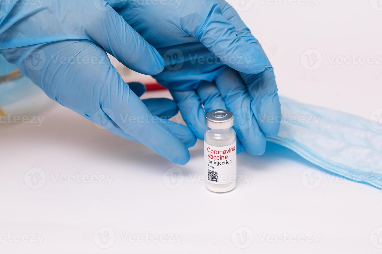 Coronavirus vaccine. Doctor with a vaccine. Hands holding a coronavirus vaccine ampoule, Covid-19 photo