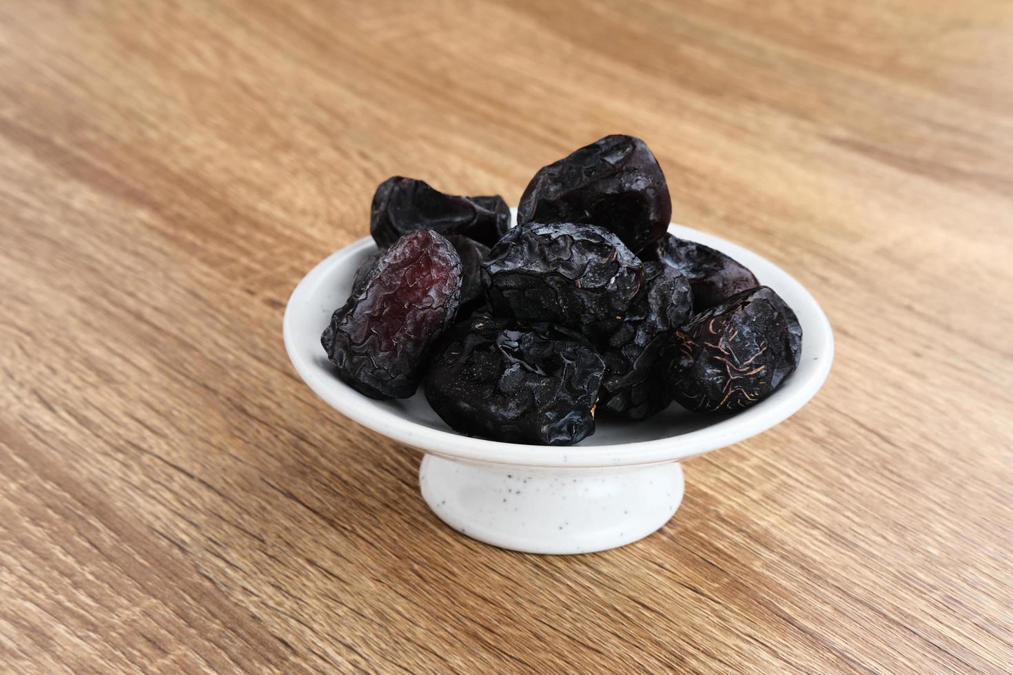 Kurma Ajwa, Ajwa Dates, served in small plate. Kurma Ajwa is one of the special fruit of Arabic. photo