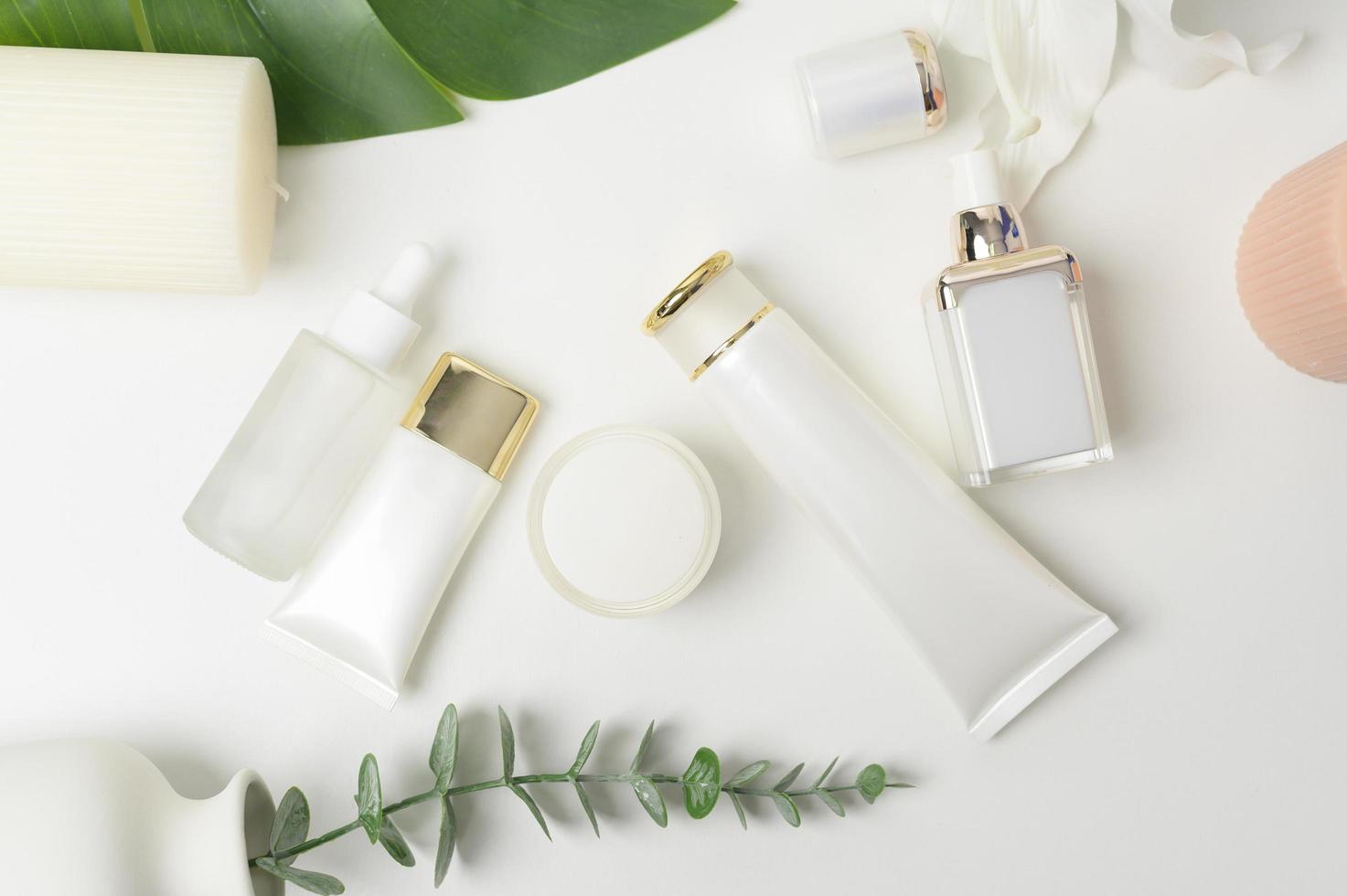 moisturizing cream bottle over leaf background studio, packing and skincare beauty concept photo