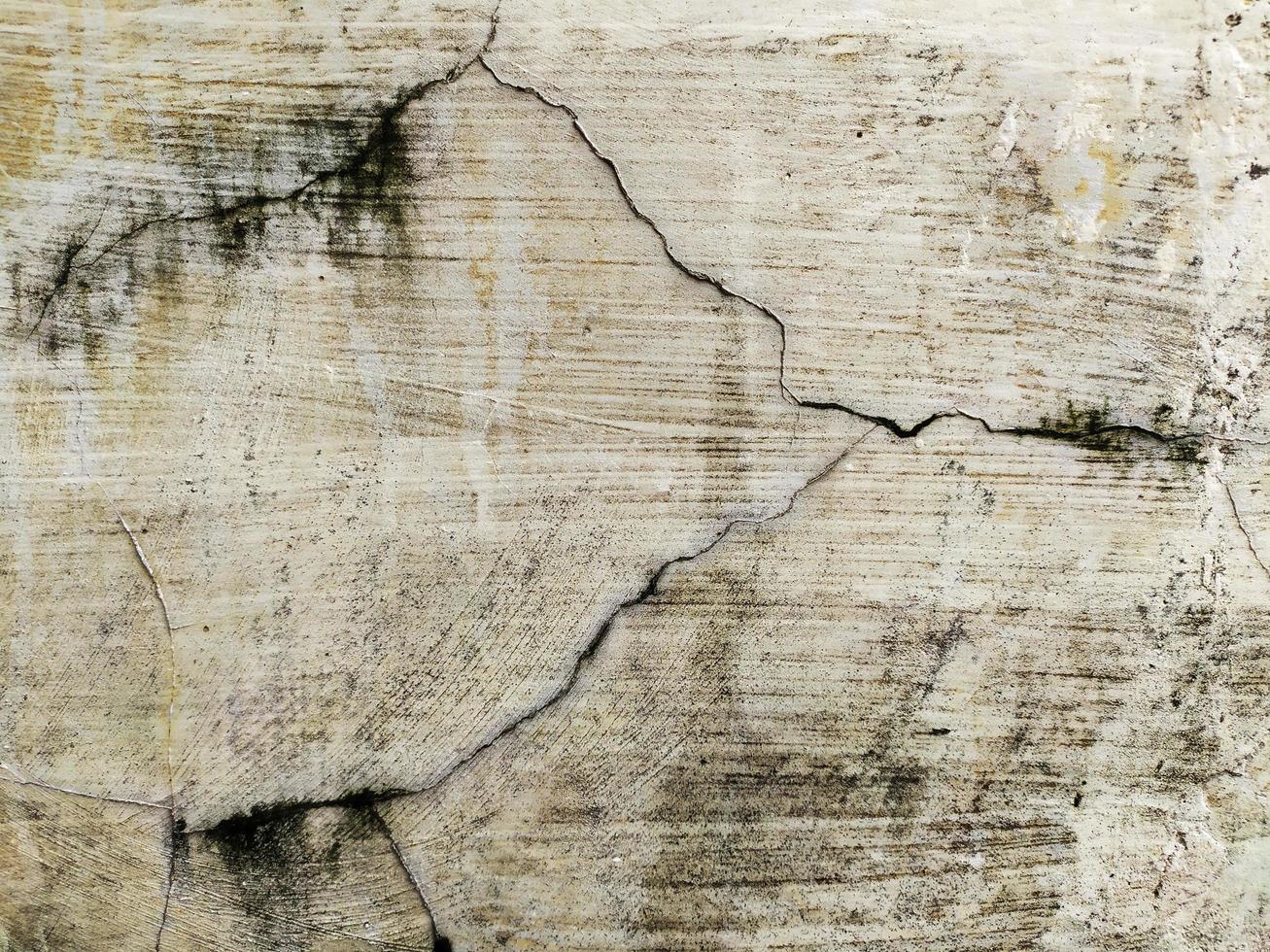 old grunge cement wall background with crack pattern photo