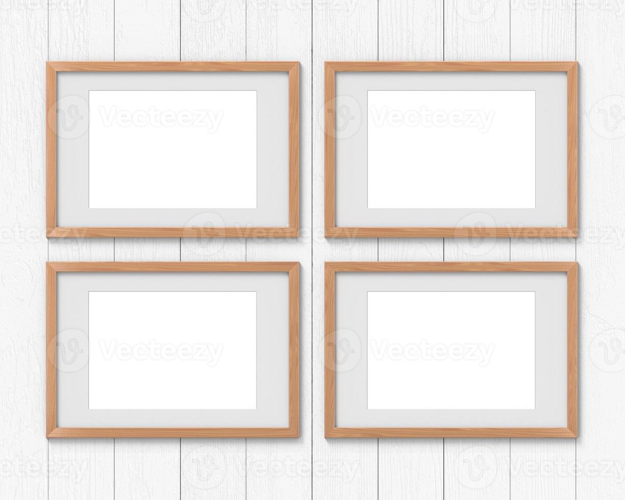 Set of 4 horizontal wooden frames mockup with a border hanging on the wall. Empty base for picture or text. 3D rendering. photo