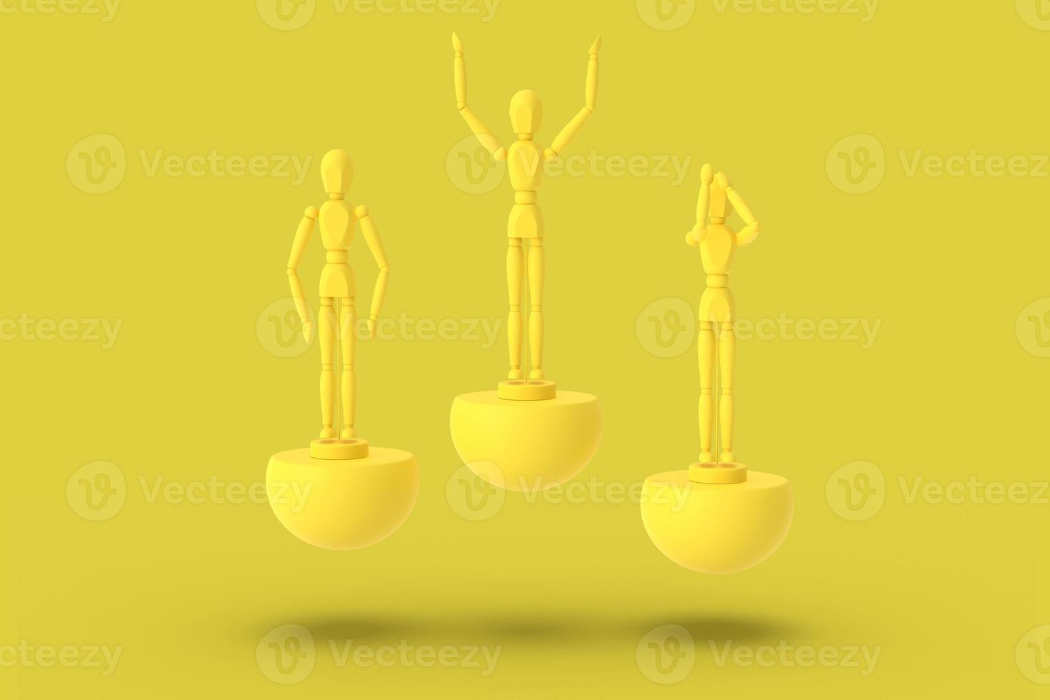 tres hombres de juguete de color amarillo sobre un pedestal abstracto deportivo. foto