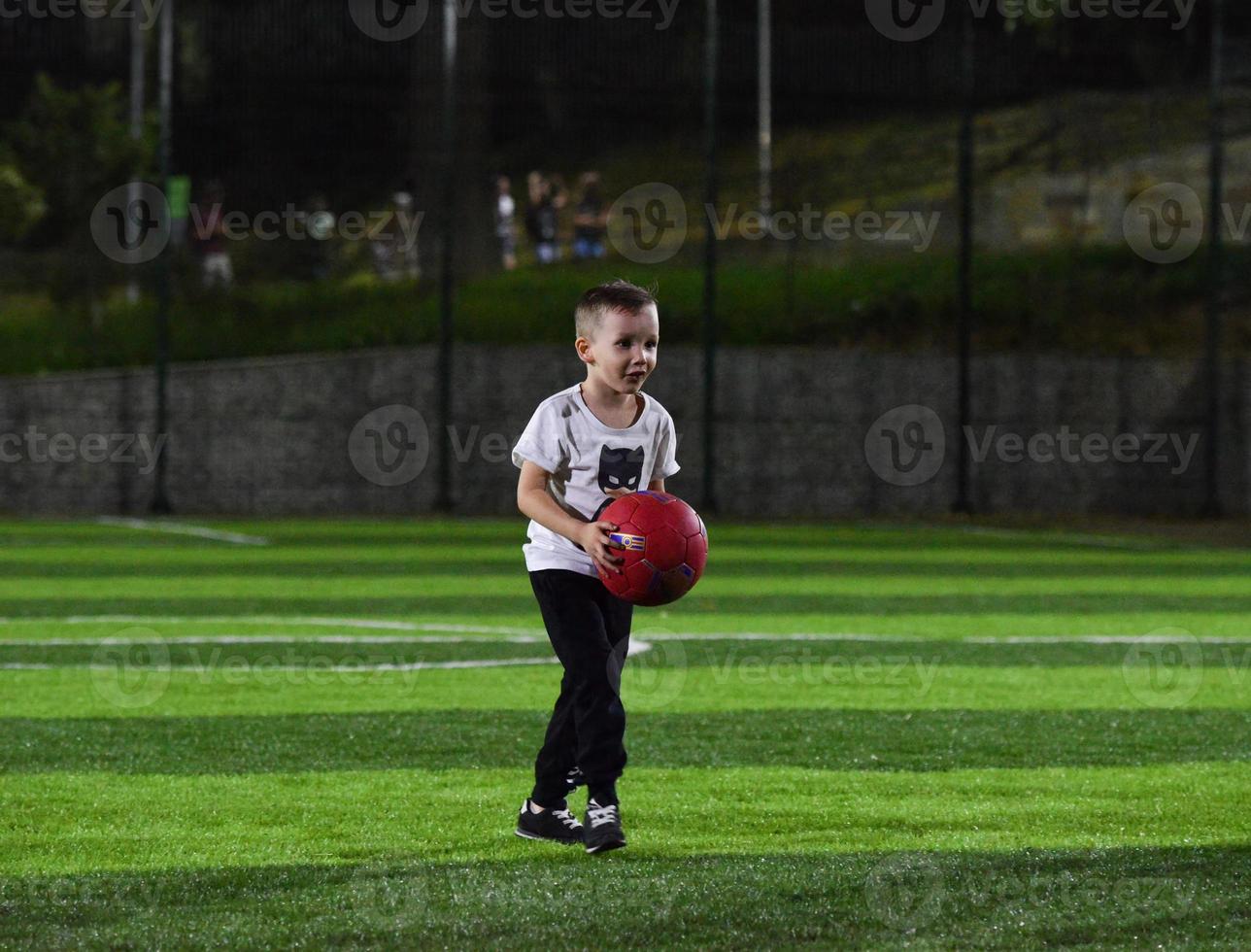 little boy playing ball photo