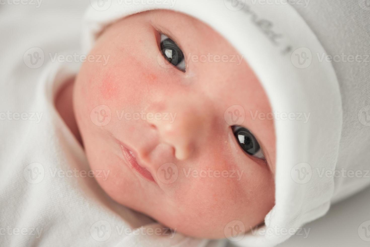 face baby in a white hat photo