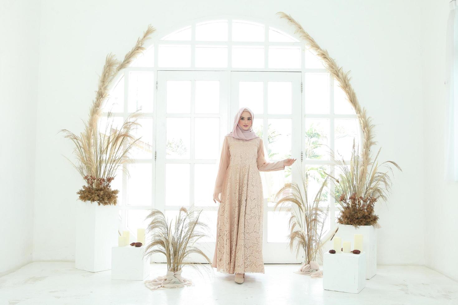 Full body portrait of lady use a wedding dress, wedding makeup on hijab. Malay or indonesia wedding dress, beauty or eidul fitri concept. Beautiful southeast asian muslim woman posing in islam dress photo