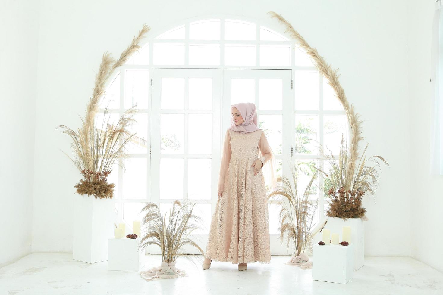 Full body portrait of lady use a wedding dress, wedding makeup on hijab. Malay or indonesia wedding dress, beauty or eidul fitri concept. Beautiful southeast asian muslim woman posing in islam dress photo