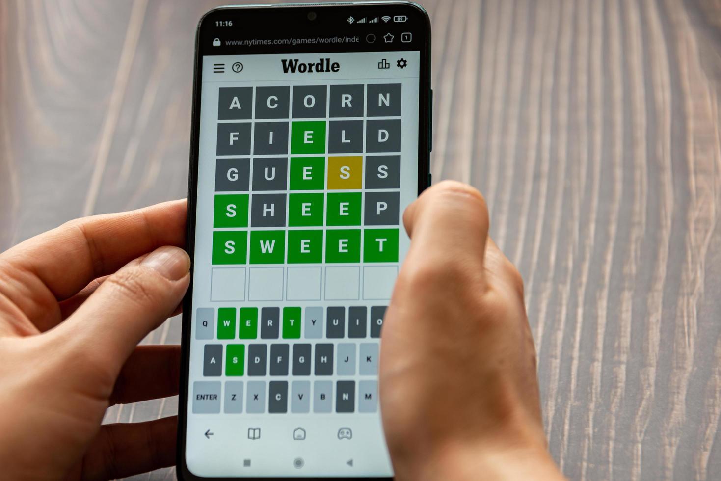 Bucharest, Romania, 2022 - A man plays the WORDLE game on the New York Times website photo