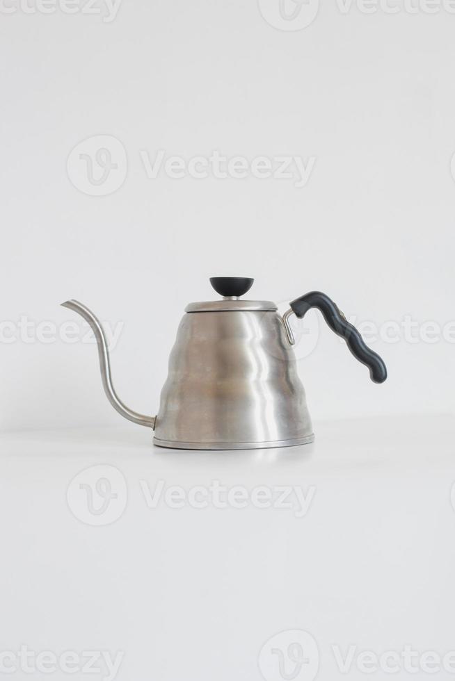 Metal goose neck kettle isolated on white background photo