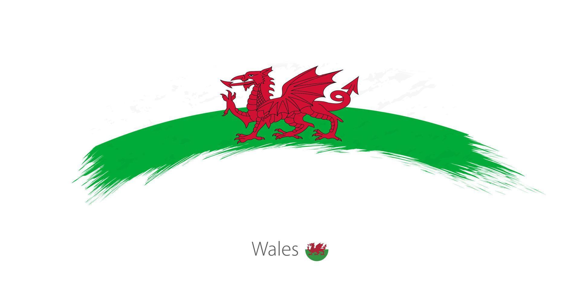 Flag of Wales in rounded grunge brush stroke. vector