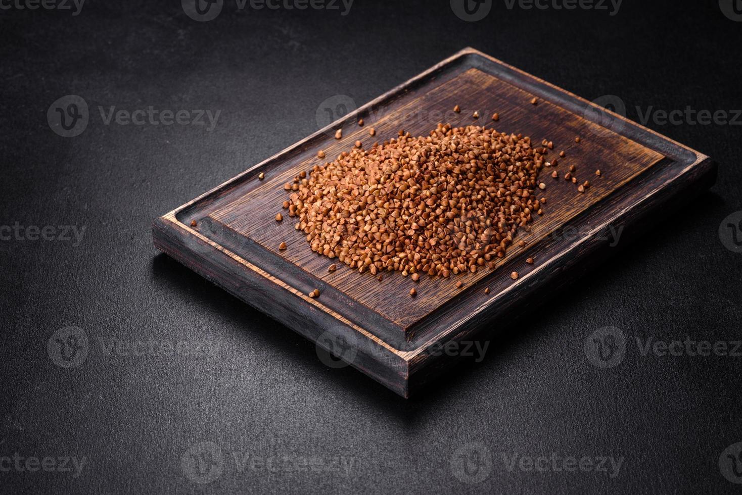 Bio buckwheat cereals raw food background, texture close up photo