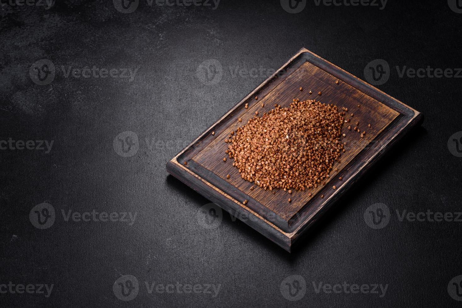 Bio buckwheat cereals raw food background, texture close up photo