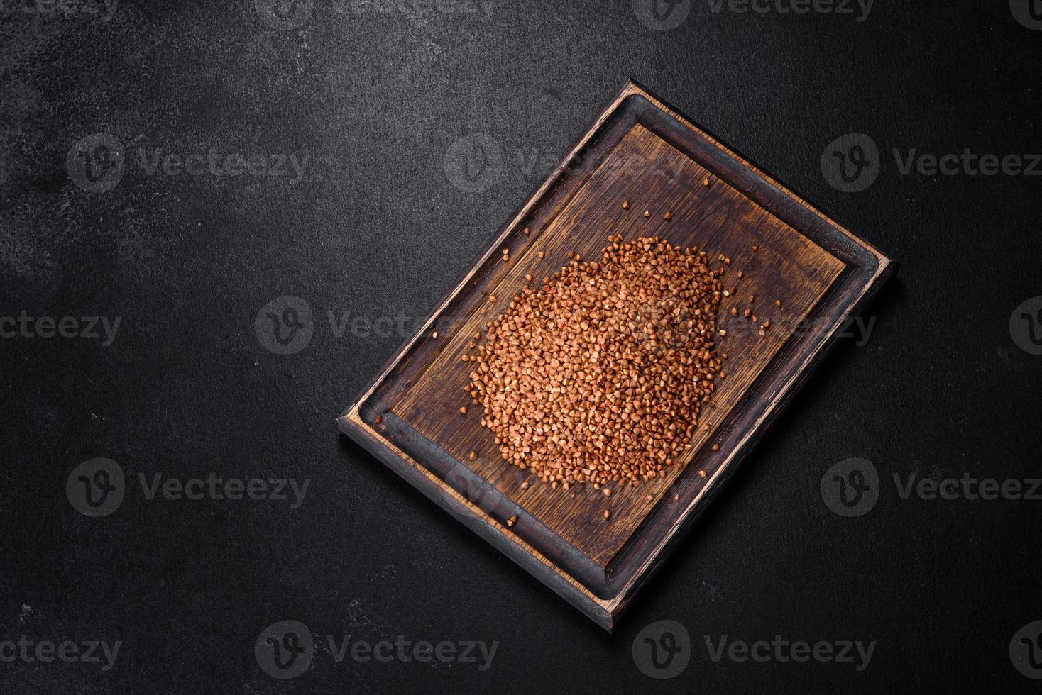 Bio buckwheat cereals raw food background, texture close up photo