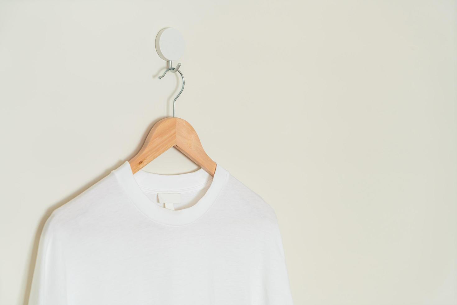 t-shirt hanging with wood hanger photo