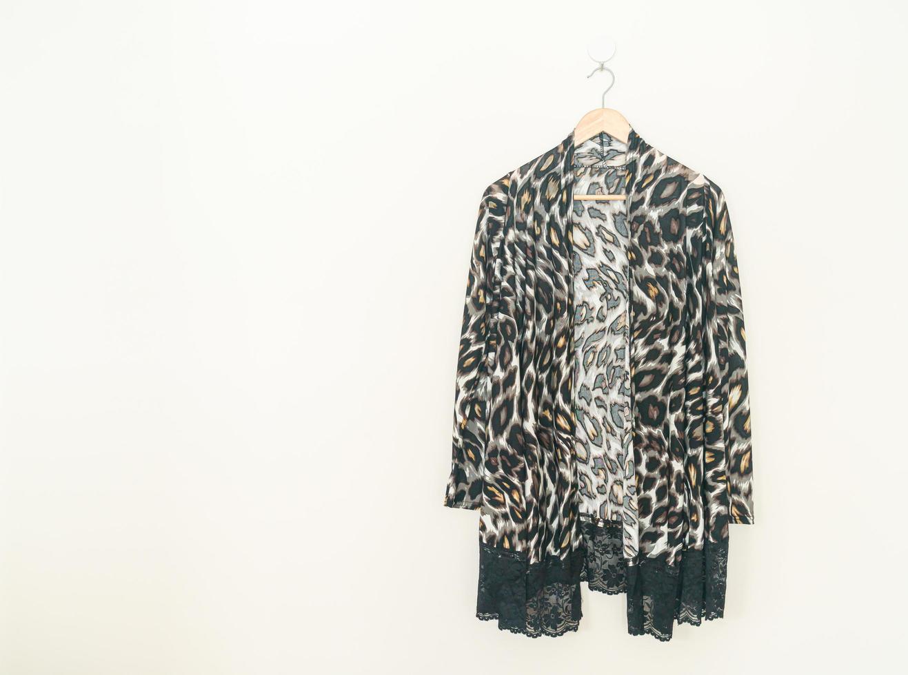 beautiful leopard print shirt hanging on wall photo