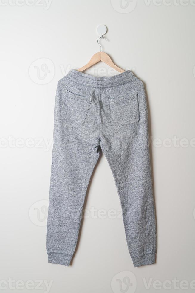 sweatpants or jogger pants hanging on wall photo