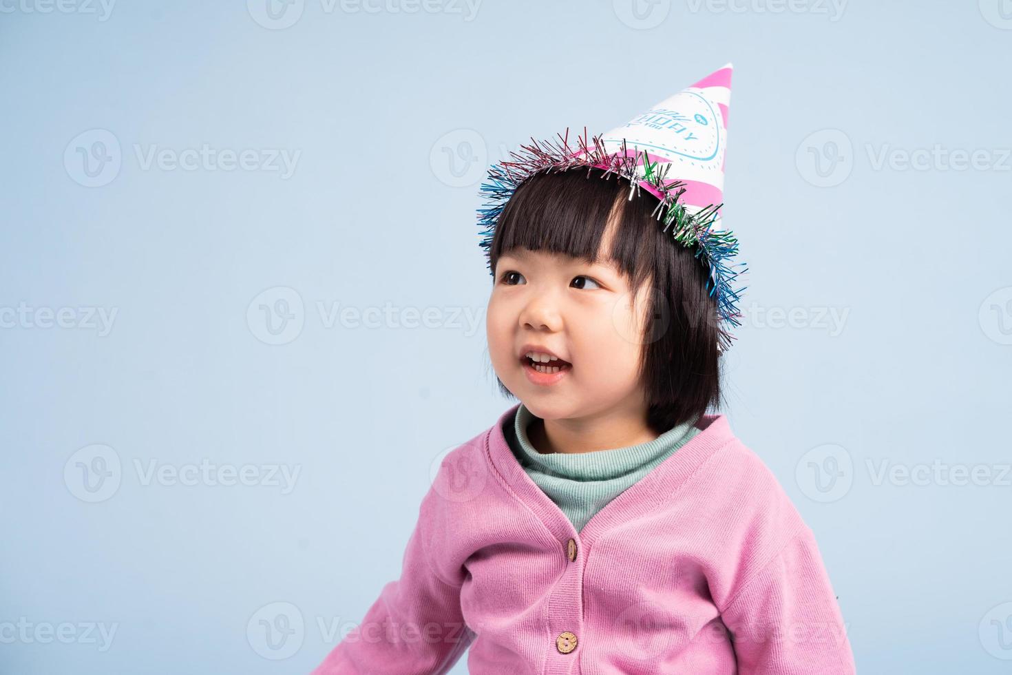 lovely baby girl portrait, isolated on blue background photo