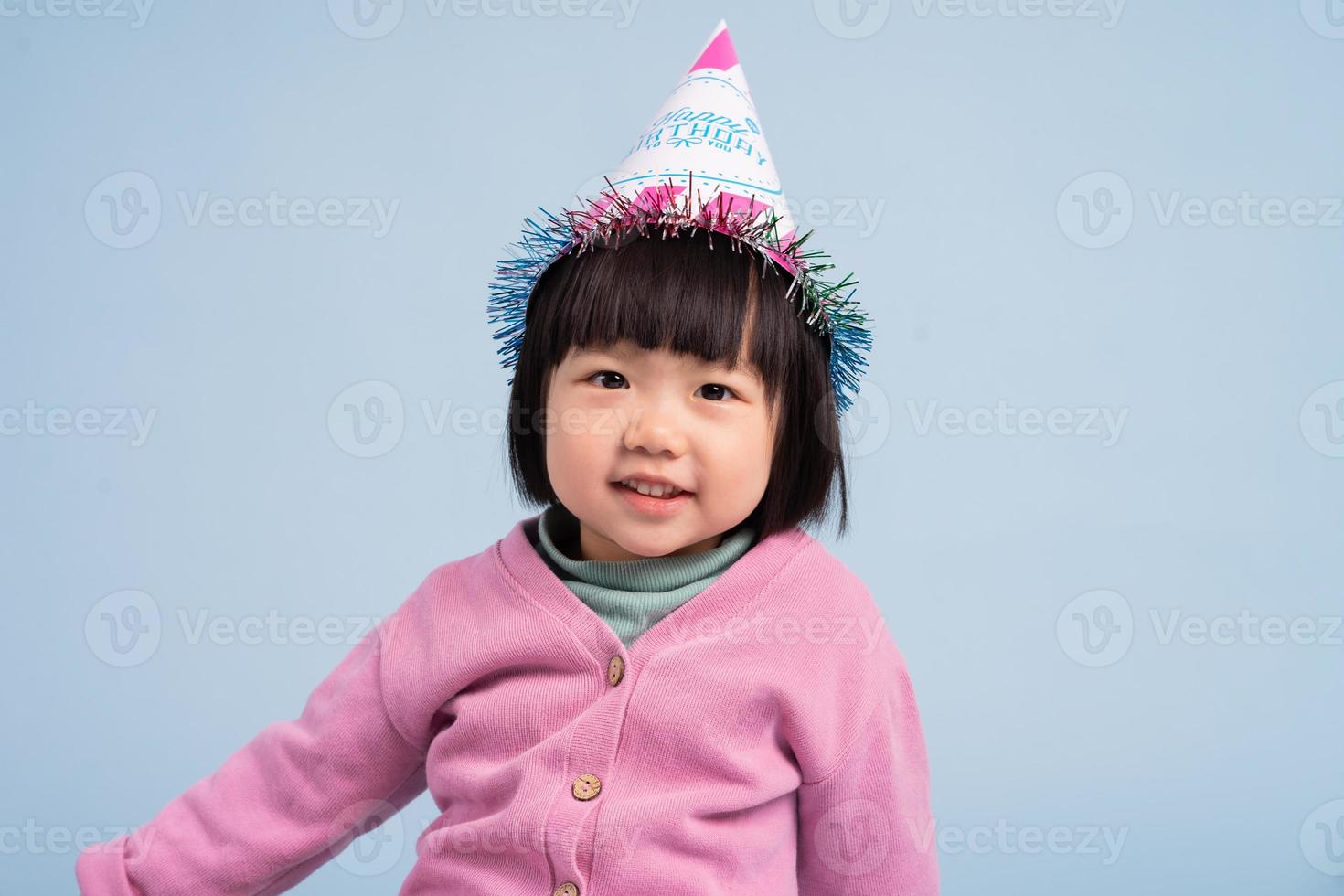 lovely baby girl portrait, isolated on blue background photo