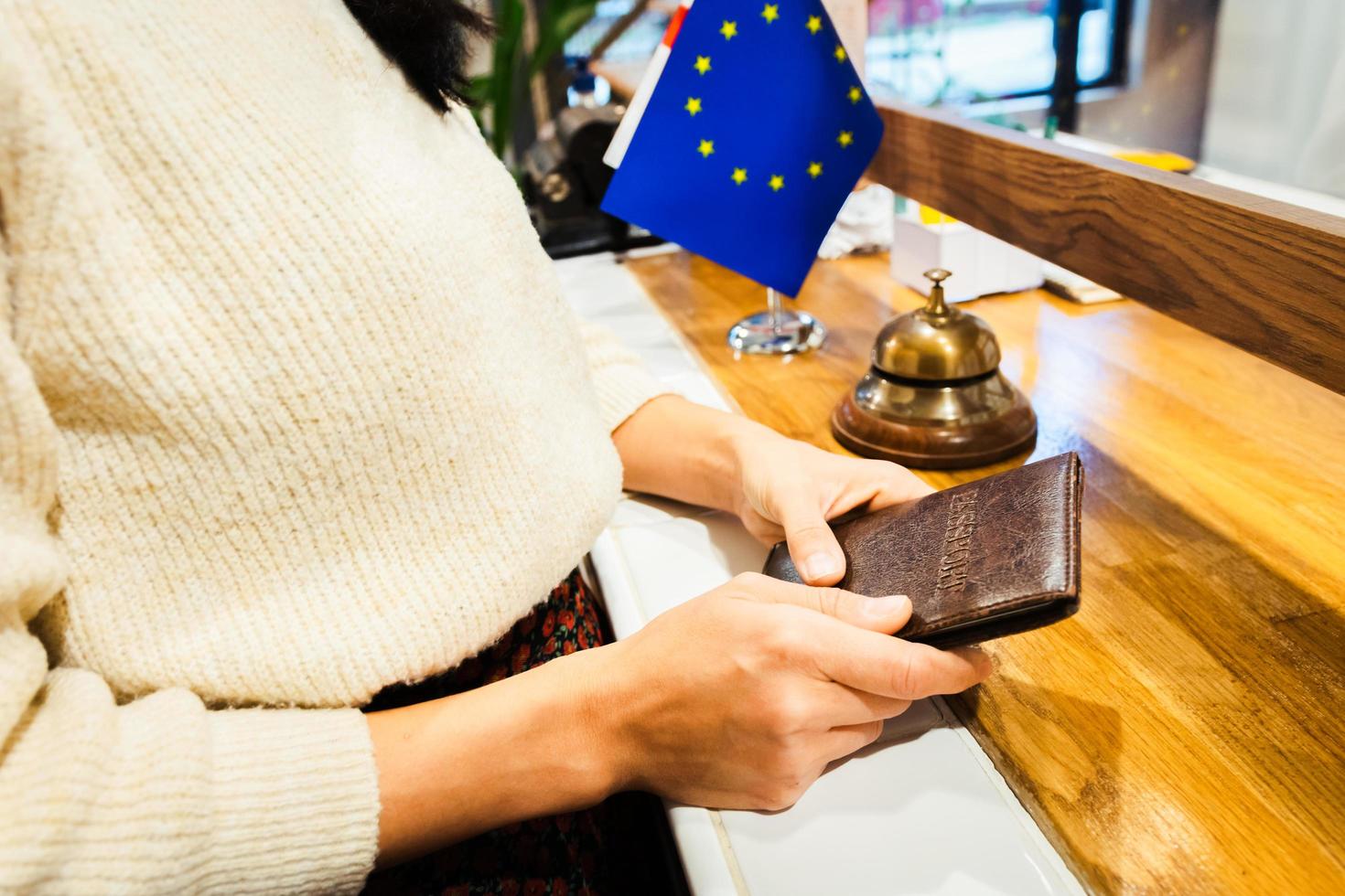 Tourist hold passport at check in photo