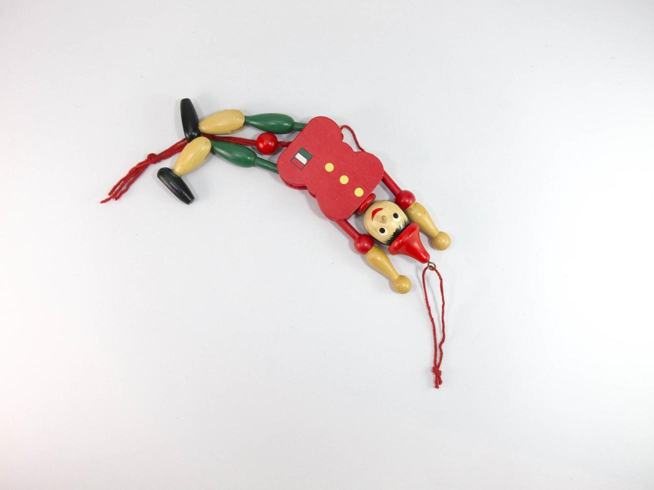 puppet Old wood Green and red puppet dolls On a white background. photo