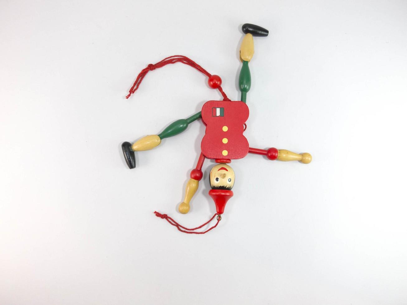 puppet Old wood Green and red puppet dolls On a white background. photo