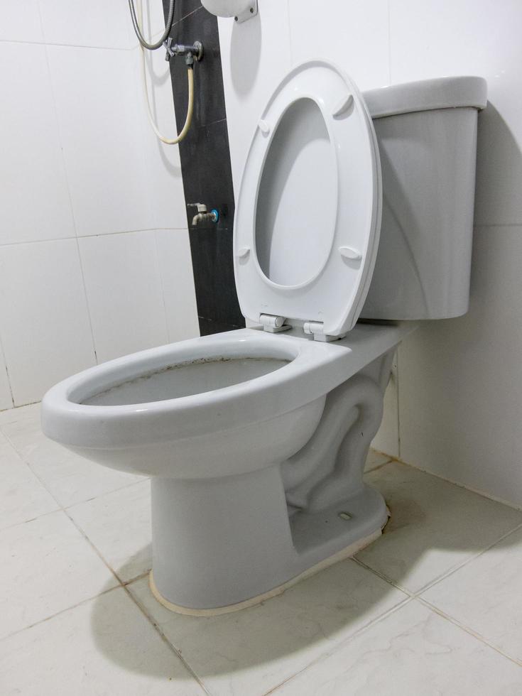 flush White toilet in white bathroom. photo