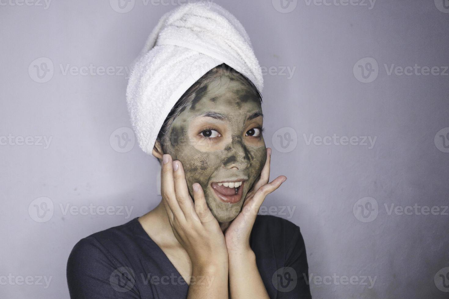 Smile Asian women smiling when she use beauty face mask photo