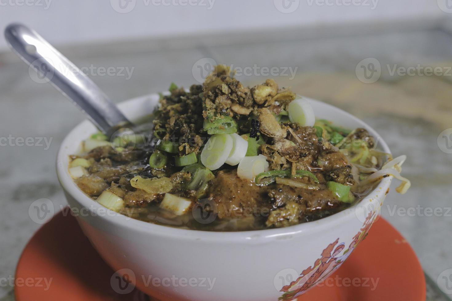 Soto Tauco from fermented soy bean and soto. Original from Tegal, Indonesia. Selective Focus photo