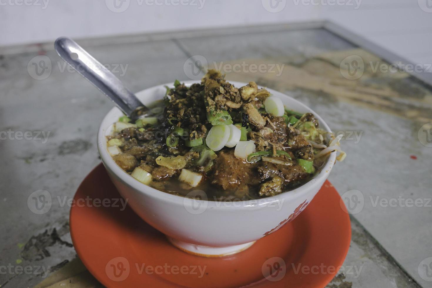 Soto Tauco from fermented soy bean and soto. Original from Tegal, Indonesia. Selective Focus photo